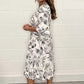 🌸✨👗Elegant V-ringad klänning med botaniskt tryck för kvinnor