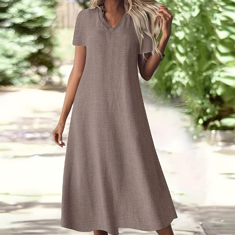👗🌸 Mångsidig sommarklänning med V-hals och korta ärmar– luftig, smickrande & perfekt för alla dagar
